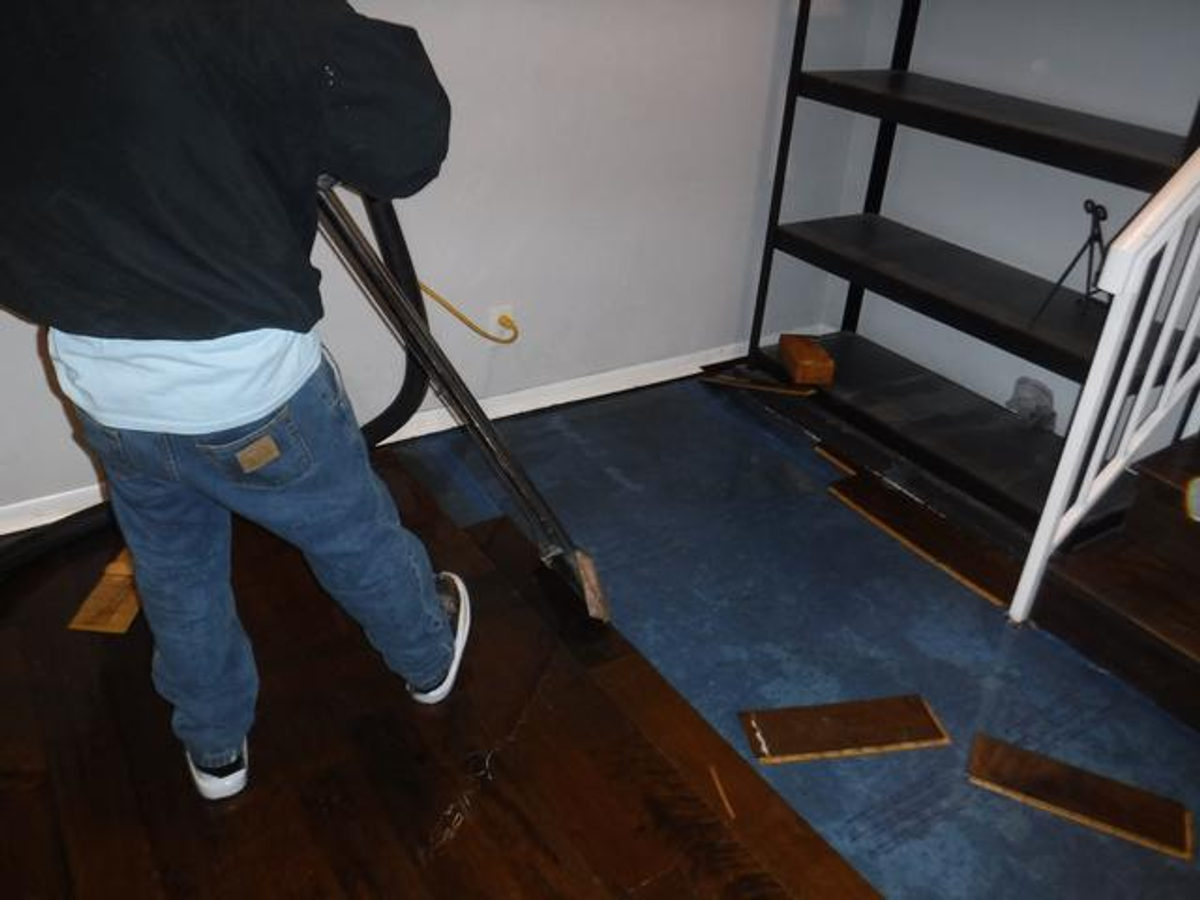 Removing wet wood panels during a water restoration job