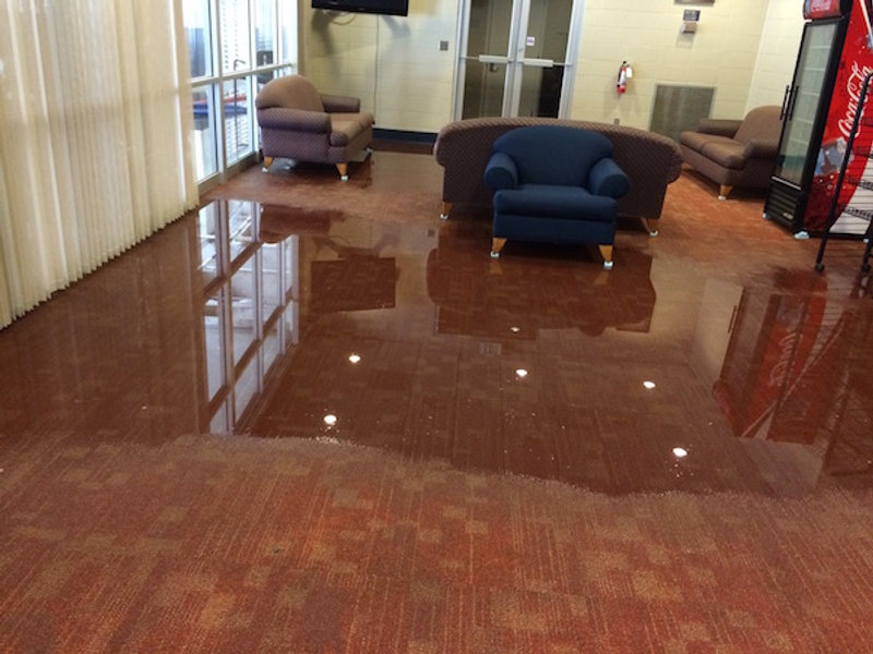 Flooded commercial lobby awaiting water extraction